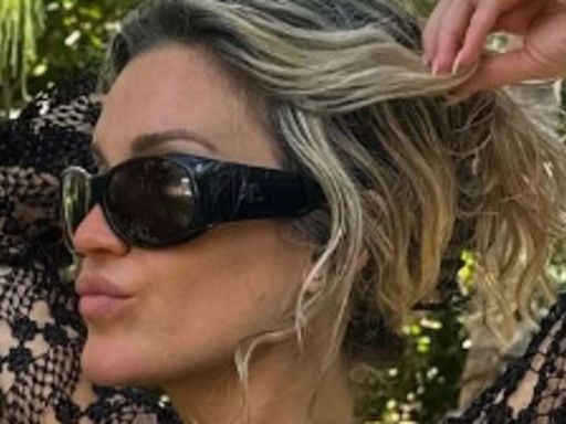 Ashley Roberts flaunts her sensational figure in a skimpy black bikini