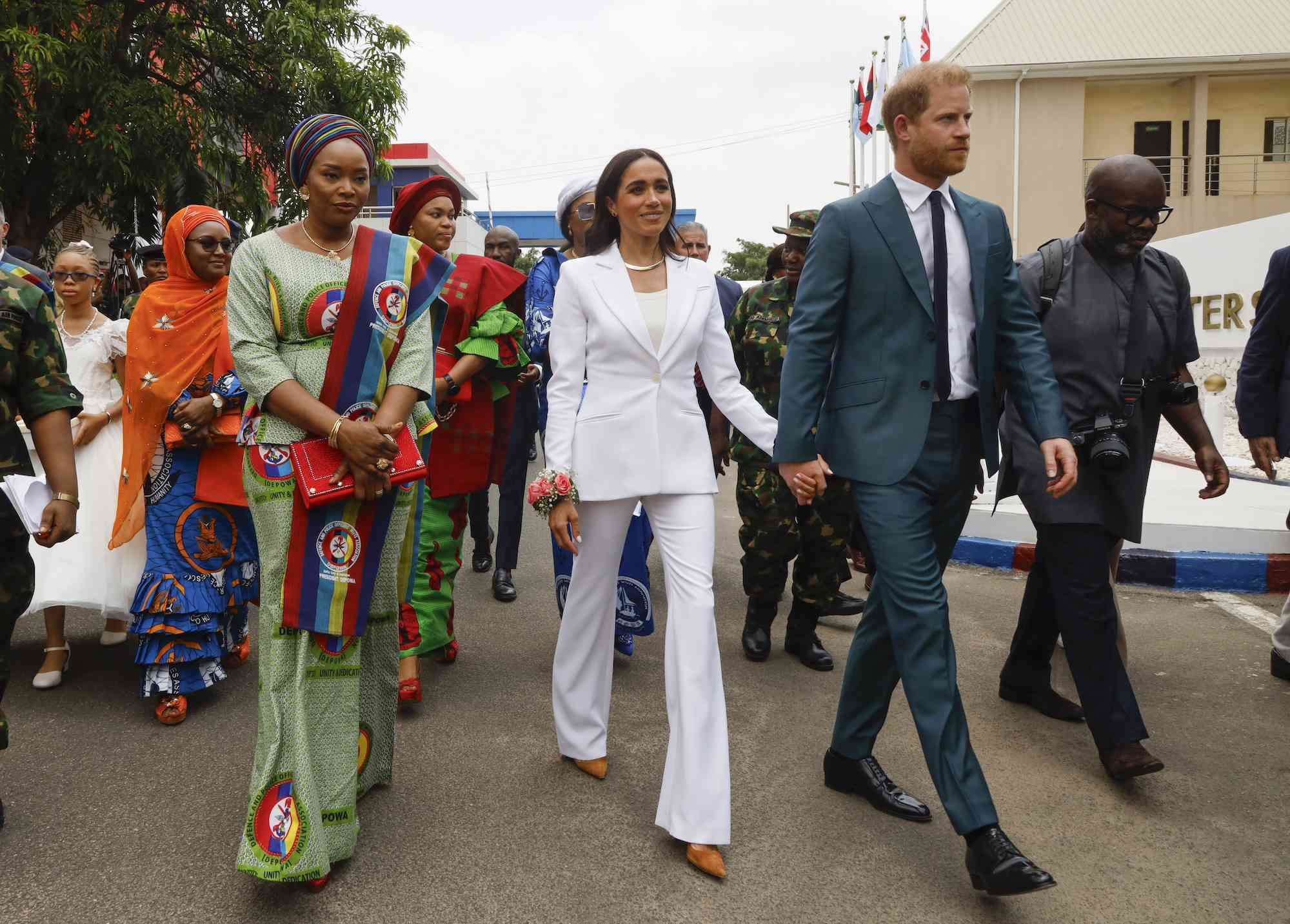 Meghan Markle Nails Business Chic in an All-White Suit on Her Nigerian Tour