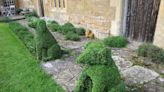 Worcestershire gardener commended in award ceremony for dog sculptures