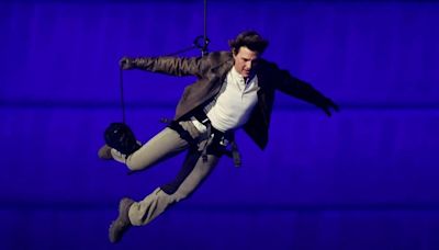 Tom Cruise abseils off stadium roof in daring Olympic finale