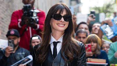 Anne Hathaway Taps Into Andy Sachs's Spirit With a Skintight Leather Suit