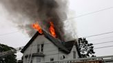 Three-alarm house fire in Brockton leaves two firefighters injured, 11 residents displaced