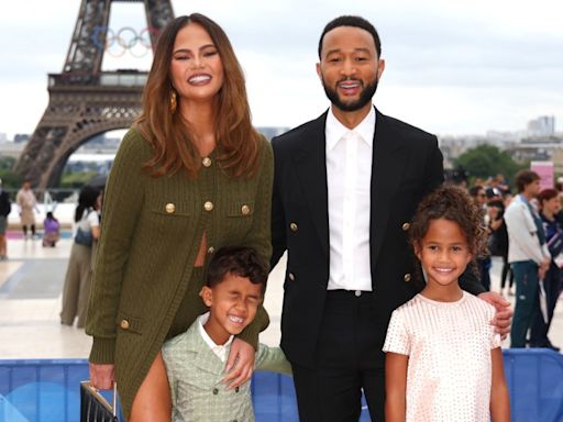 Chrissy Teigen Embraces Knitting in Chloé’s Micro Shorts, John Legend Suits Up in Louis Vuitton for Paris Olympics Opening Ceremony