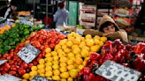 Argentina reports its first single-digit inflation in 6 months as markets swoon and costs hit home