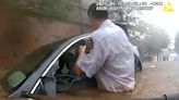 Firefighter, Police Officer Rescue Trapped Georgia Driver During Heavy Flooding — Watch