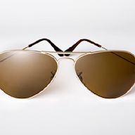 Originally designed for pilots, aviator sunglasses have a teardrop shape and thin metal frames. They are popular for their classic and timeless look, and are often seen as a symbol of coolness and adventure. They are suitable for most face shapes and are available in a variety of lens colors.