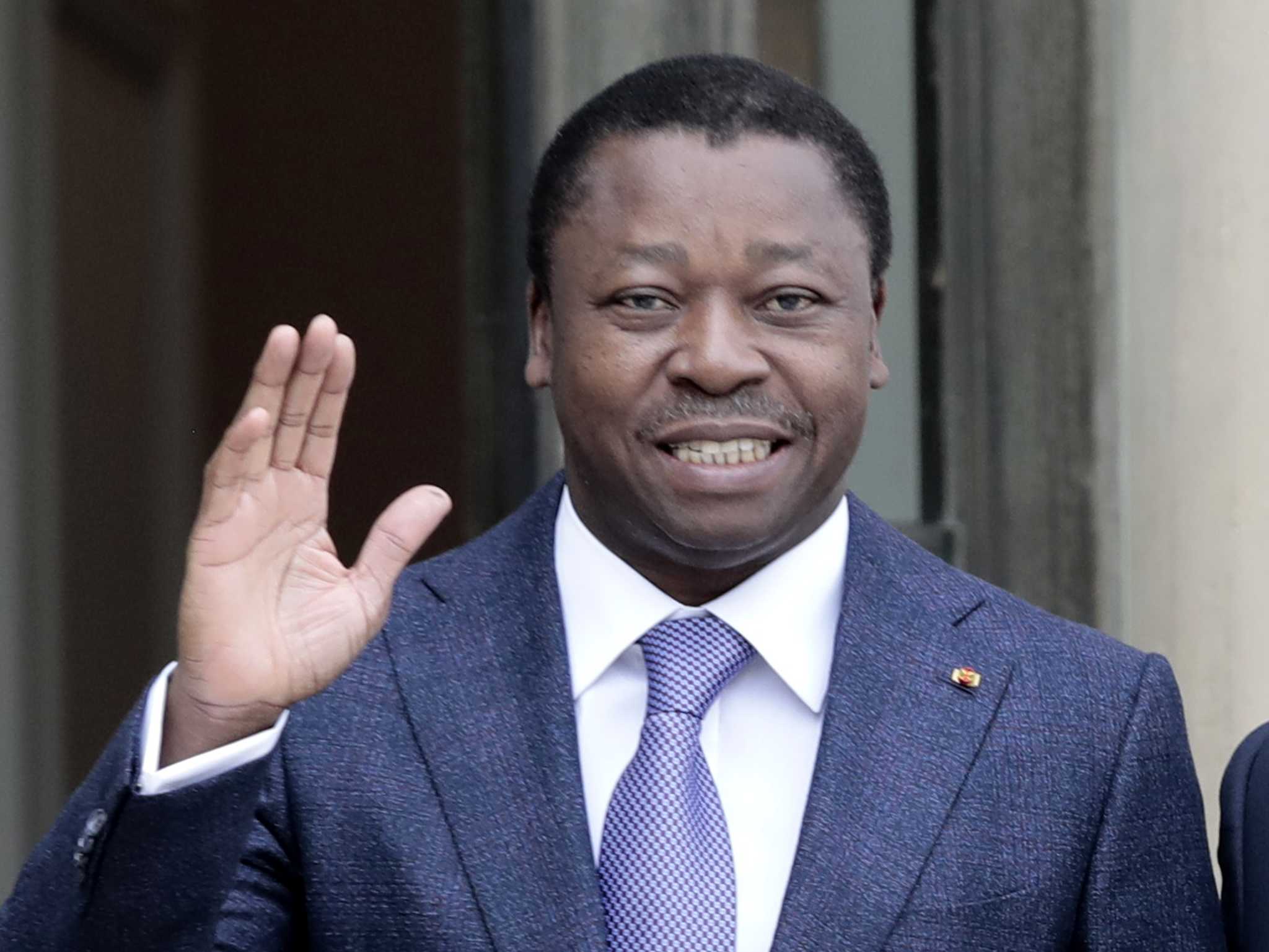 Togo's longtime leader signs a new constitution that eliminates presidential elections