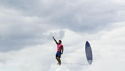 Right place, right time: The story behind the viral surfing photo from the Paris Olympics