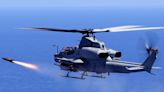 A US Marine Corps attack helicopter fired off a new 'fire and forget' missile for the first time in the Pacific, striking a moving vessel