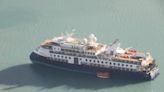 Luxury cruise passengers stuck in Arctic after ship runs aground