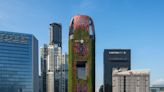 Inside Singapore's famous 'living tower,' a 620-foot hotel that's covered in red mesh and is being intentionally overrun with greenery