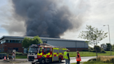 Large parcel centre fire causes huge smoke plume