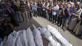 An Airstrike Kills 20 in Central Gaza and Fighting Rages as Israel's Leaders Air Wartime Divisions