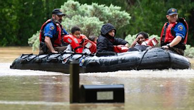 Southeast Texas flooding: photos capture water rescues of people and pets and severe damage to homes