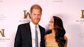 Meghan Markle shines in gold alongside her mom and Prince Harry to accept award in NYC