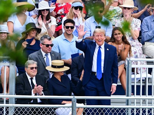 Melania Trump laughs at Donald during Barron's graduation