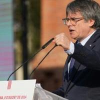 Catalonia's exiled separatist leader Carles Puigdemont made a brief speech and then vanished