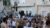 A Palestinian Orthodox Christian priest guides Easter mass for the minority community in Gaza, outside the Church of Saint Porphyrius in Gaza City