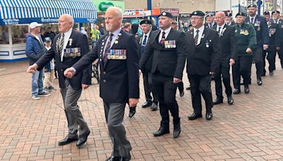 Hundreds line street to pay tribute to military