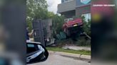 VIDEO: Red pickup, utility truck involved in crash in Dallas