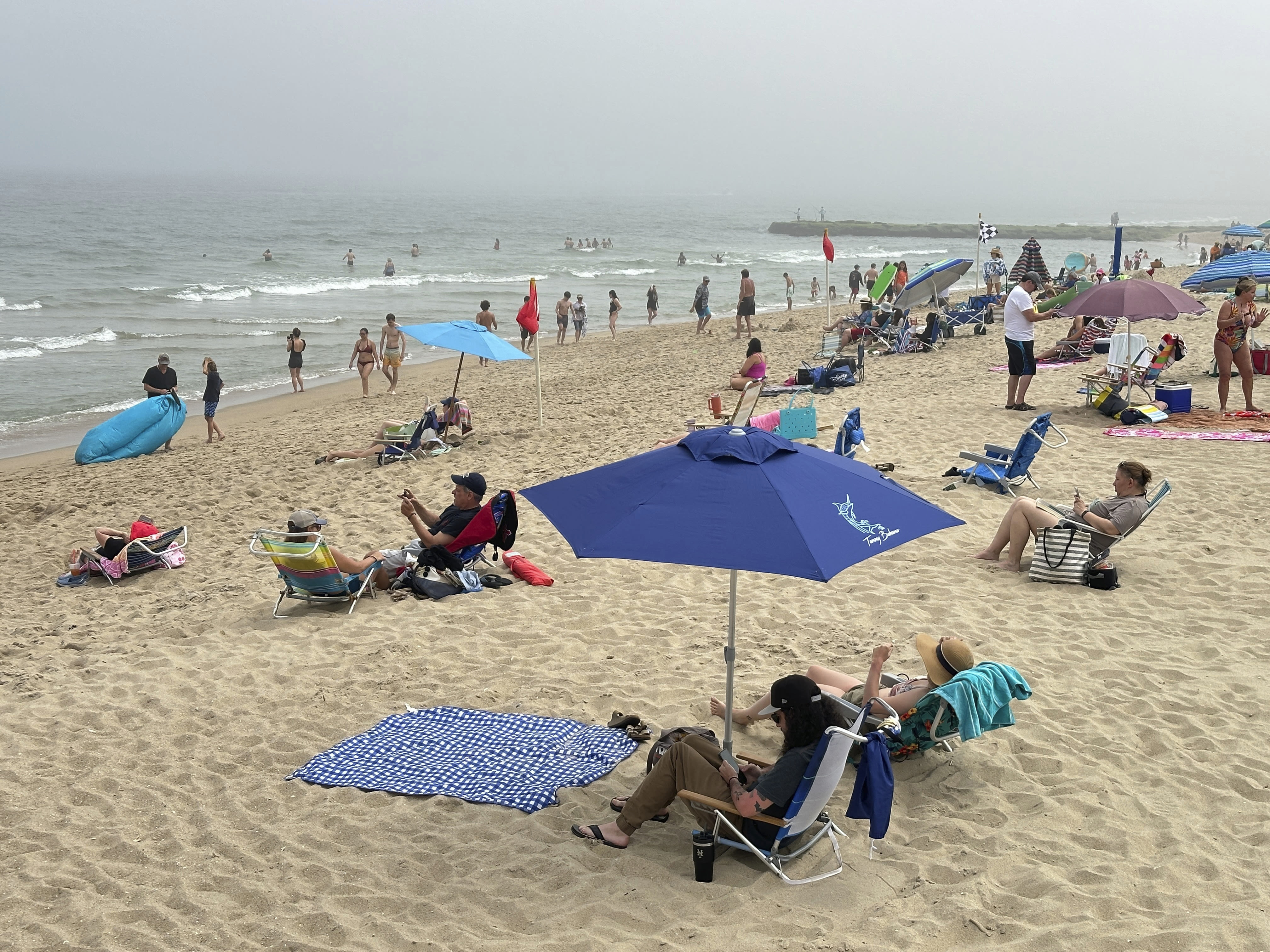 Christian group temporarily opens beaches it has closed on Sunday mornings as court fight plays out