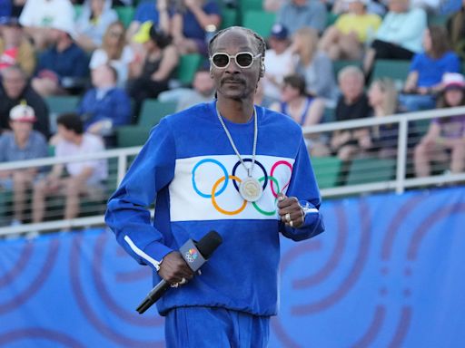 Why Snoop Dogg is back at the Olympics (and even carrying the Olympic torch)