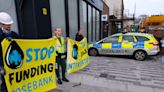 Two arrested after bank windows smashed in climate protest