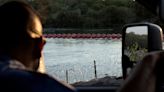 Case over Rio Grande migrant barrier may be too 'political' for court review