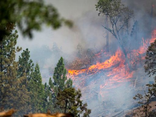 Firefighters cautiously watch the weather as Western wildfires spread