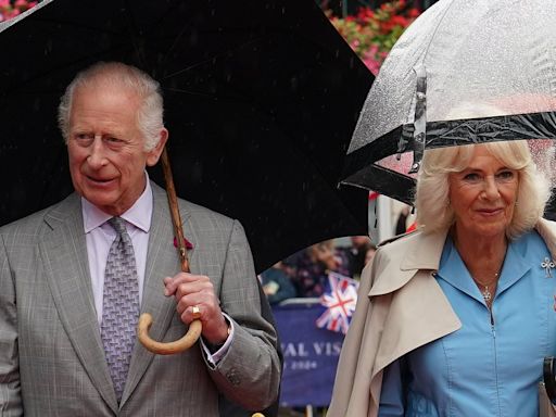 Queen Camilla left in hysterics over some VERY frisky cows