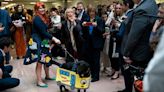 Romney steps in as Halloween dog parade emcee