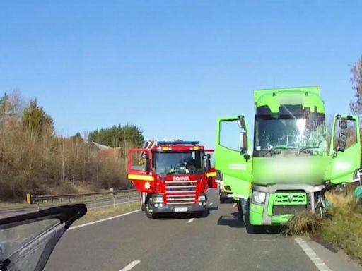 WATCH: Shocking moment truck smashes into two stationary vans on A11