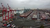 Hundreds of Liverpool dockworkers begin two-week strike over pay