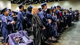 Parents of slain students walk the stage in their honor at Eastern High School's graduation