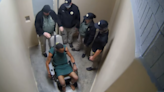 Lawsuit says video shows 3 jailers watch as officer wrapped chain around detainee’s neck and briefly choked him | CNN