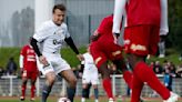 Macron takes part in charity soccer game, showing off sporting prowess