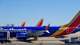 Southwest passengers describe people vomiting and passing out during aborted landing in heavy turbulence. They were then left at an empty terminal at another airport.
