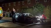 Woman, 19, arrested after car with children inside was 'set alight'