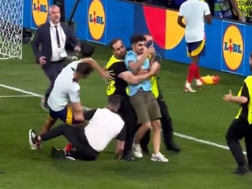 Spain's Alvaro Morata suffers injury scare after security guard slides into him during celebrations