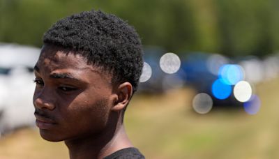 A teen charged with killing 4 people at a Georgia high school was interviewed about online threats