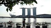 Expat pay packages jump in Singapore, drop in Hong Kong