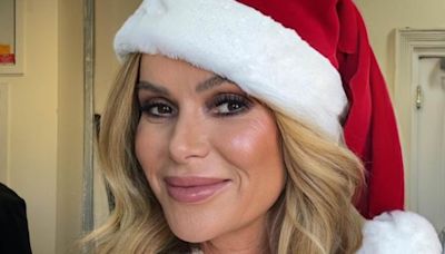 Amanda Holden gets into the festive spirit early in a Santa costume