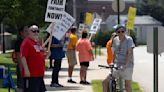 Dubuque school bus drivers picket for better wages, benefits