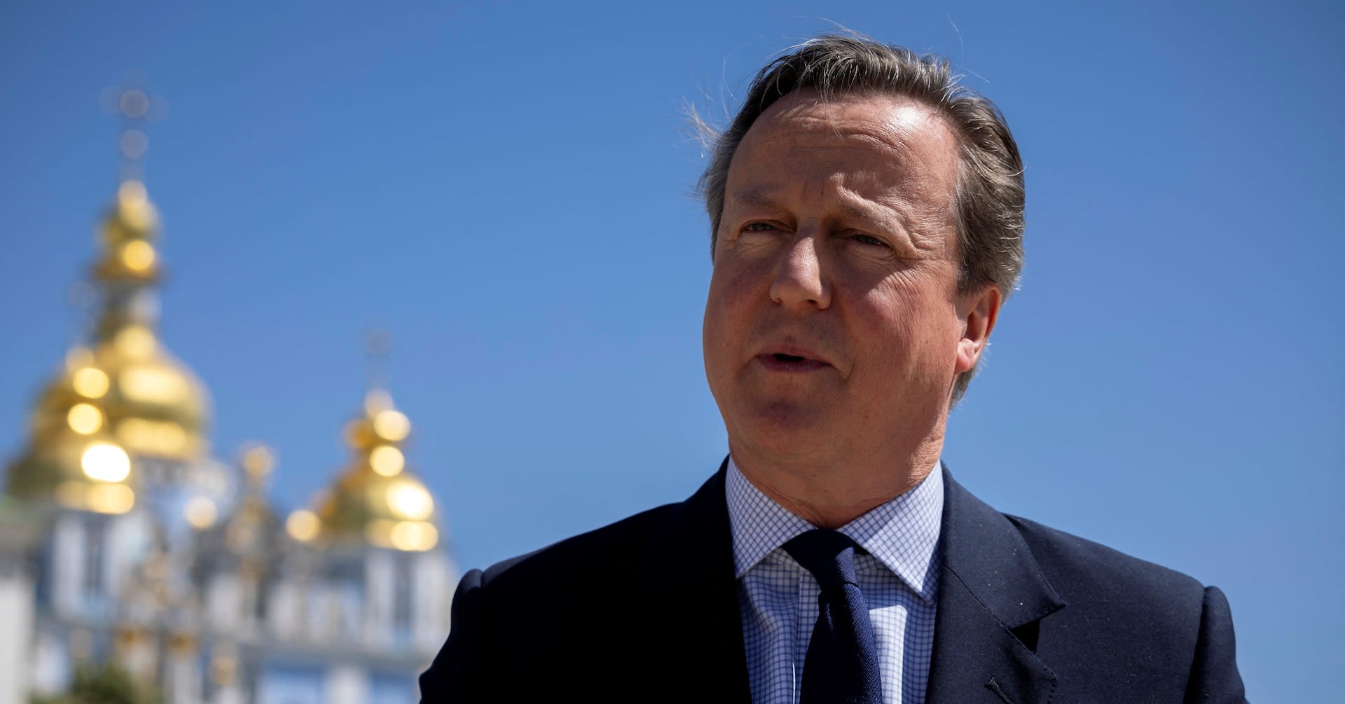 Britain's Cameron, in Kyiv, promises Ukraine aid for 'as long as it takes'