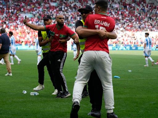 Fans invade pitch as Argentina v Morocco Olympics opener ends in chaos