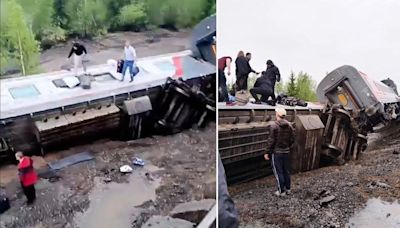 Two killed after tourist train derails and crashes into river
