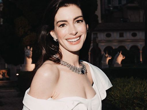 Anne Hathaway's Thigh-High Boots and Hot Pants Is So Andy Sachs-Inspired