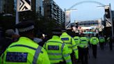 Three charged over Champions League pitch invasion