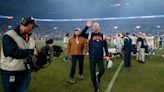 Broncos owner Greg Penner gave Jerry Rosburg a game ball after Sunday’s win