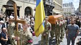 Thousands attend funeral of former Ukrainian lawmaker killed in Lviv